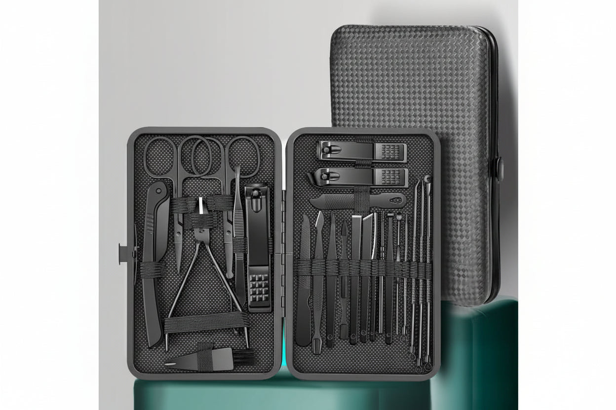 Manicure set with tools in a black case on a gray background
