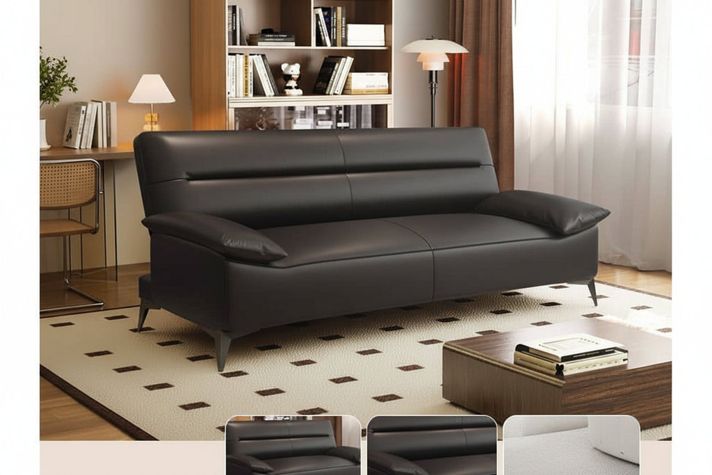 Black leather sofa in a living room setting with furniture and decor.