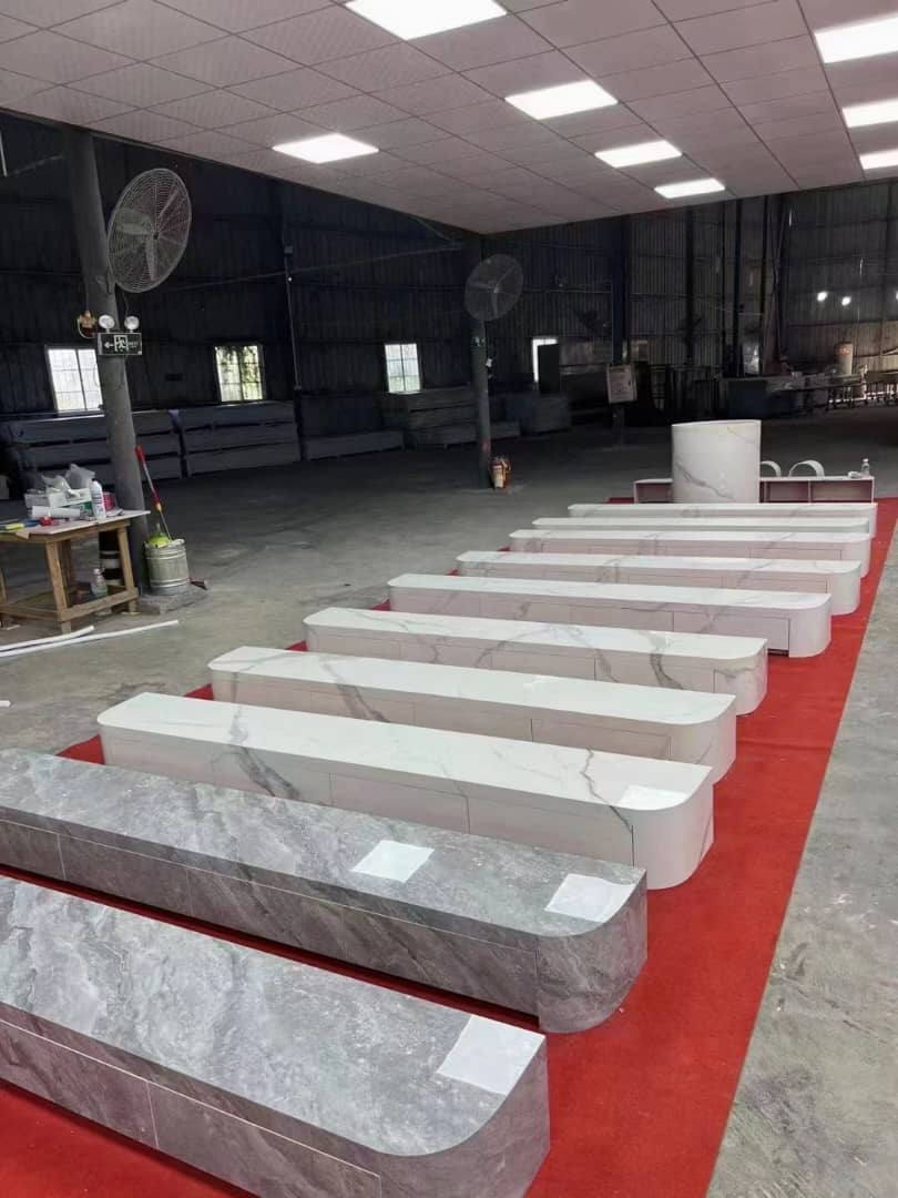 Row of stone slabs on a red platform in an indoor setting