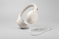 White headphones with text on a dark background