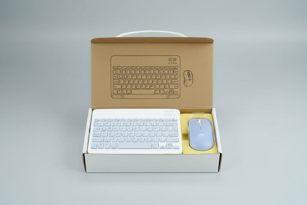 Keyboard and mouse set with cardboard box packaging on a reflective surface.