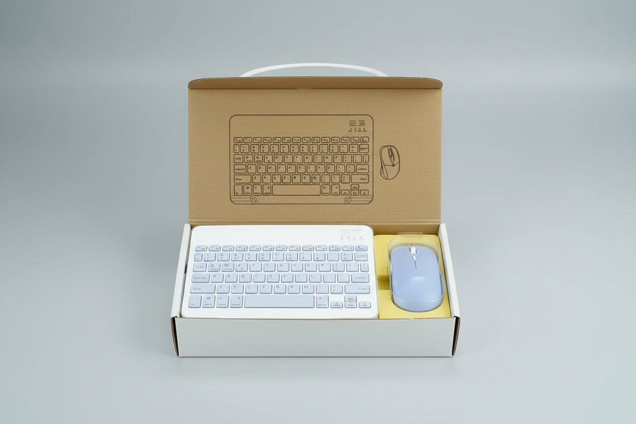 Keyboard and mouse set with cardboard box packaging on a reflective surface.