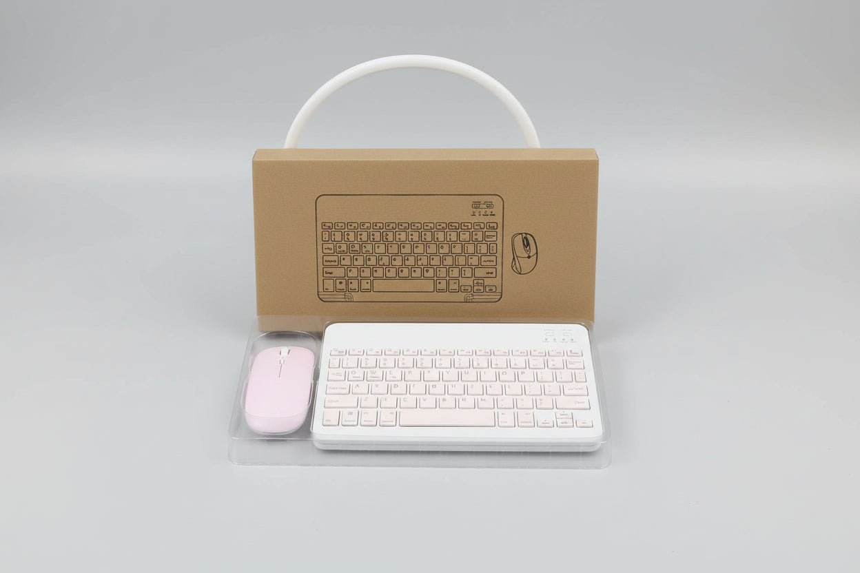 Wireless keyboard and mouse set with cardboard box on a light blue surface.