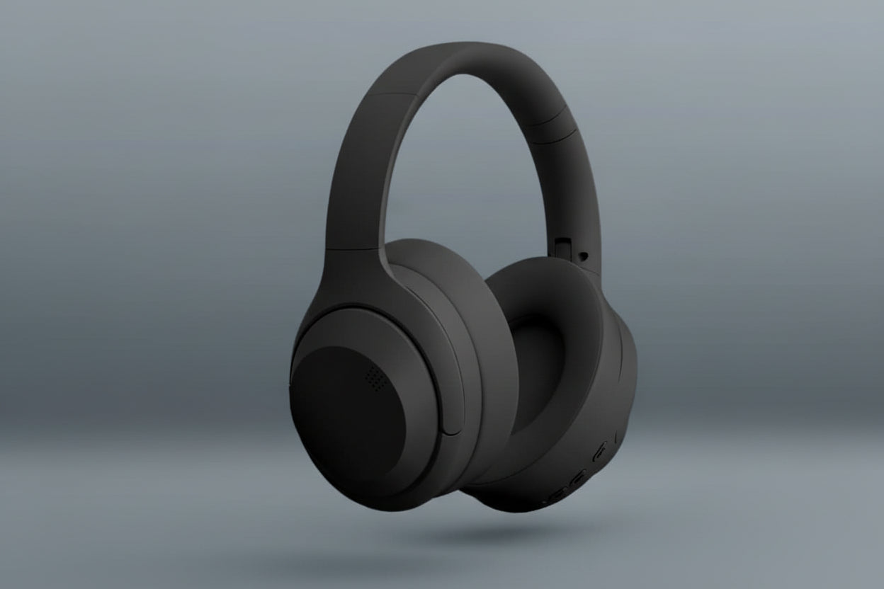 Black wireless headphones with feature text on a gray background