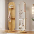 Wooden standing mirror with a cabinet in a room setting