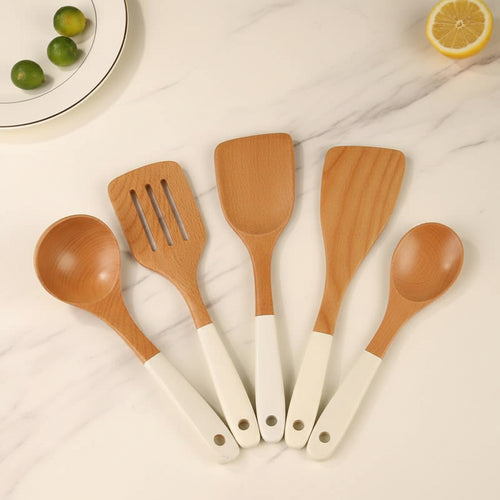 Set of wooden kitchen utensils on a light background with text overlay