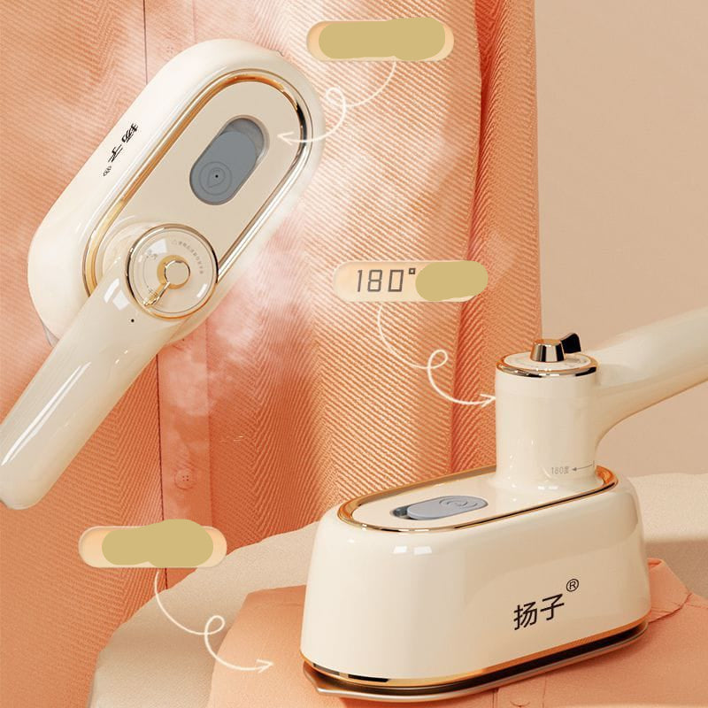 White handheld steamer with gold accents on a pink background