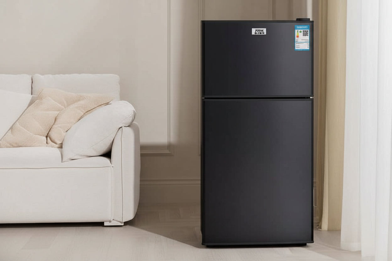Black refrigerator with promotional text on a light-colored wall background