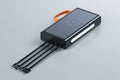 Wireless charging device with four lines on a dark background